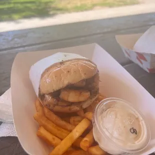 Seafood sandwich and fries.