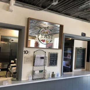 a counter with a mirror above it