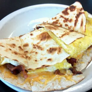 a breakfast burrito on a plate