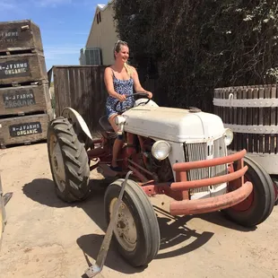 a woman on a tractor