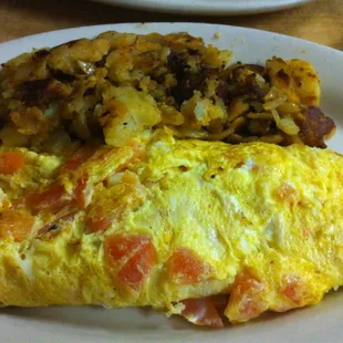 Tomato cheese omelette. Comes with home fries/grits, toast and tea/coffee.