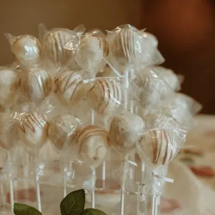 Cake pops by a piece of cake.