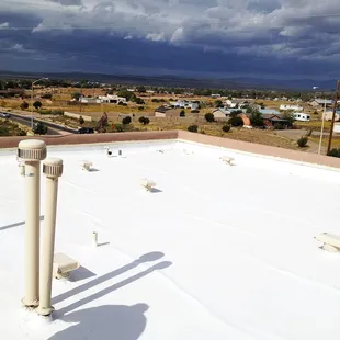 Silicone Coated Roll Roofing on a 2 story home in Santa Fe, NM.