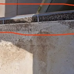 roof gravel left in gutter: brown tint due to no or inadequate primer &amp; silicone