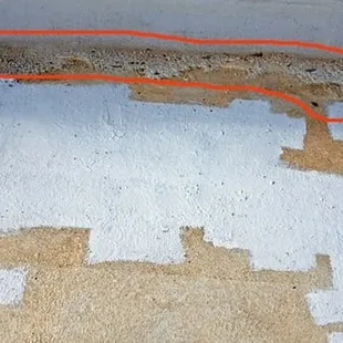 silicone delaminating from parapet area, inadequate silicone coat can be seen through the brown surfacing due to little or no primer.