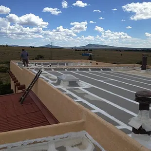 Refurb on Roll Roofing in Raton, NM. (50 yr Silicone white)