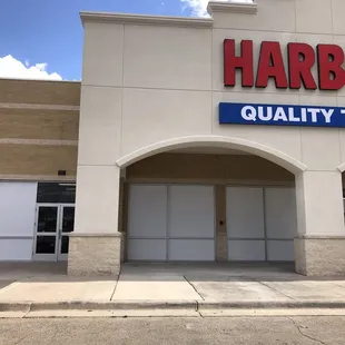 Applying white vinyl film at a harbor freight in Roswell.