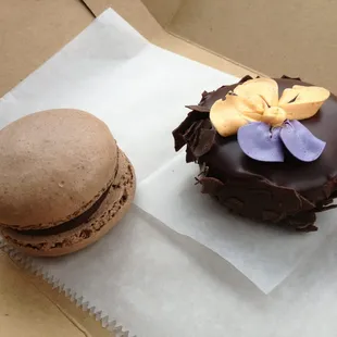 Chocolate macaron and a mini chocolate covered cheesecake. Both delicious!! Located in the bakery inside the shop.