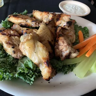 Grilled (not fried) wings. New menu item. Get them grilled with no sauce (naked) w/blue cheese.