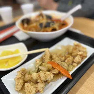 a plate of food and a bowl of soup