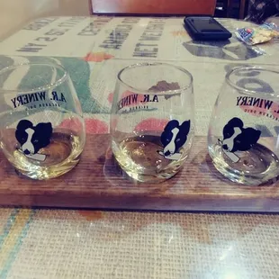 a row of glasses on a cutting board