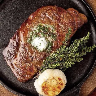 Boneless Ribeye with herb butter, roasted garlic and thyme