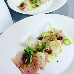 Hamachi Crudo served with blood orange, avocado, watermelon radish, jalapeño and ponzu.