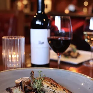 Mary&apos;s Organic Chicken, served 2 ways on top of Wild Rice with confit trumpet mushrooms and Serrano ham.