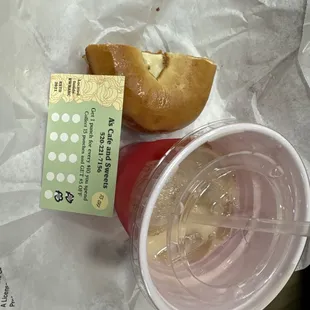 Half bagel sandwich with bacon egg cheese and cream cheese. Ice chai tea and punch card