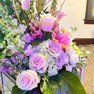 The box was an added accessory from the church. Elevated the flowers perfectly. Just in front of the pulpit. Splendid accent.