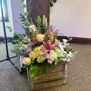 Perfect collection of flowers. Sitting in front of the pulpit. Milk crate was an accessory from the church.