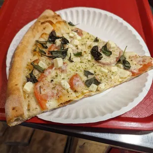 Feta tomato and basil pizza