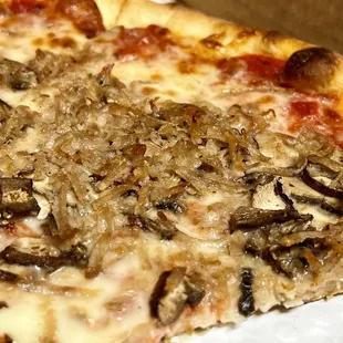 Sausage and mushroom pizza.  Why&apos;s the sausage shredded?  Strange texture.