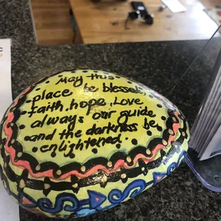 a rock with writing on it