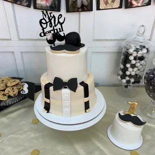 a cake with a top hat and bow tie
