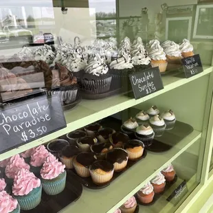a display of cupcakes and pastries