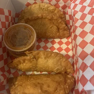 4 Roasted chicken empanadas with the Tastiest Hot Sauce!!!