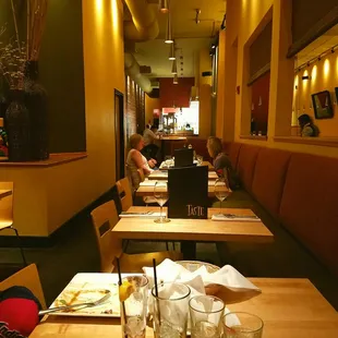 a dining area with tables and chairs
