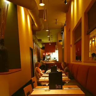 a dining area with tables and chairs