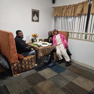 The owner - wife and couple of their customers