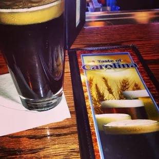 a pint of beer and a menu