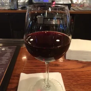 9 Oz pour of Cabernet Sauvignon $13.  Passing time during a weather delay while grumbling with fellow passengers = Priceless