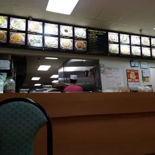 a restaurant counter and menus