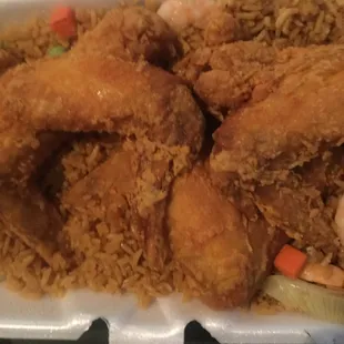 fried chicken and rice in a styrofoam container