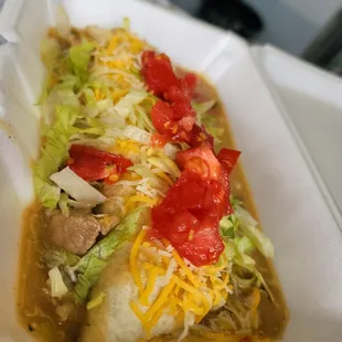 a burrito in a styrofoam container