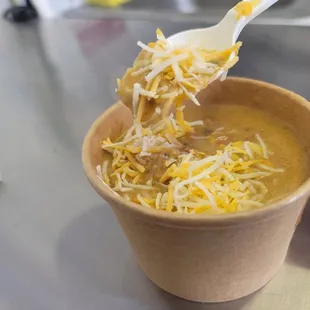 a person eating a bowl of soup