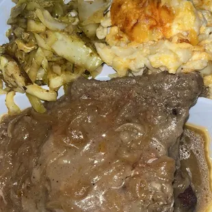 2 fried porkchops with gravy &amp; onions, macaroni &amp; cheese, and fried cabbage