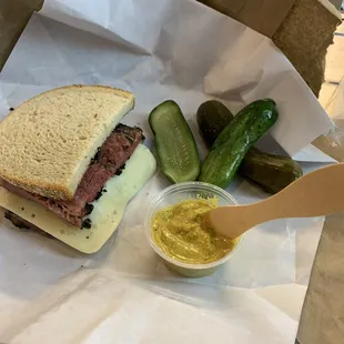 Half pastrami with Swiss cheese. Homemade pickles were amazing too!