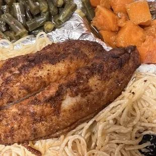 Catfish over Alfredo noodles with a side of sweet potatoes and seasoned green beans