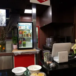 a kitchen with a counter and a refrigerator