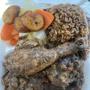 Jerk Chicken, rice and peas, sautéed cabbage and carrots, Fried Plantain