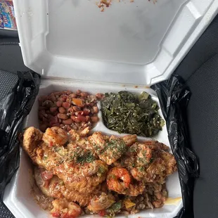 Fried turkey chops and shrimp over dirty rice, collard greens and crazy beans.