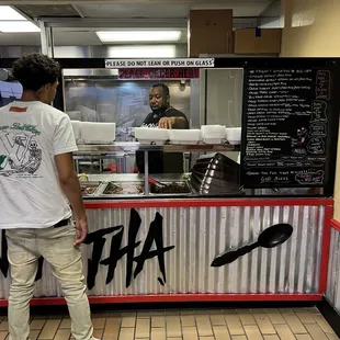 Th owner and menu board