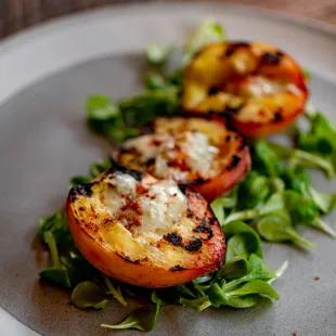 a plate of grilled peaches