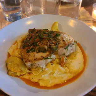 Swordfish and creamy polenta with roasted veg harissa vinaigrette