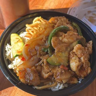 a plate of food with rice and vegetables