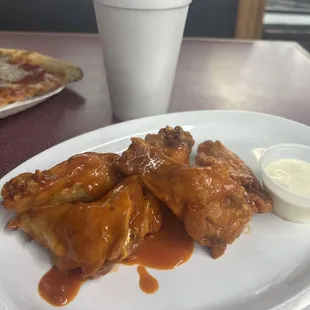 5 count buffalo wings, wings, not tossed sauce, drizzled over the top however tasty.