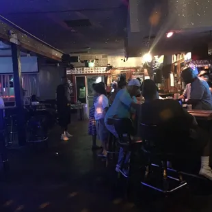 people sitting at a bar