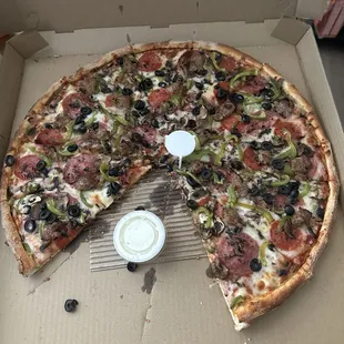 Large Combination Pizza 2 slices eaten, ranch cup for reference