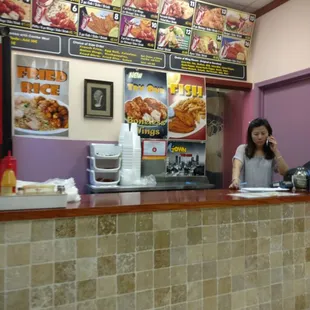 a woman sitting at a counter